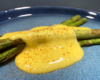 Hollandaise sauce on pan seared asparagus