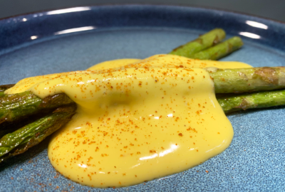 Hollandaise sauce on pan seared asparagus